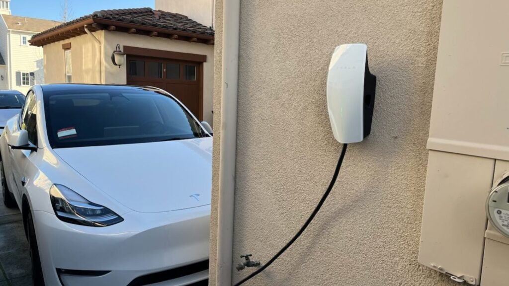 EV Charger on Side of Home Charging Car