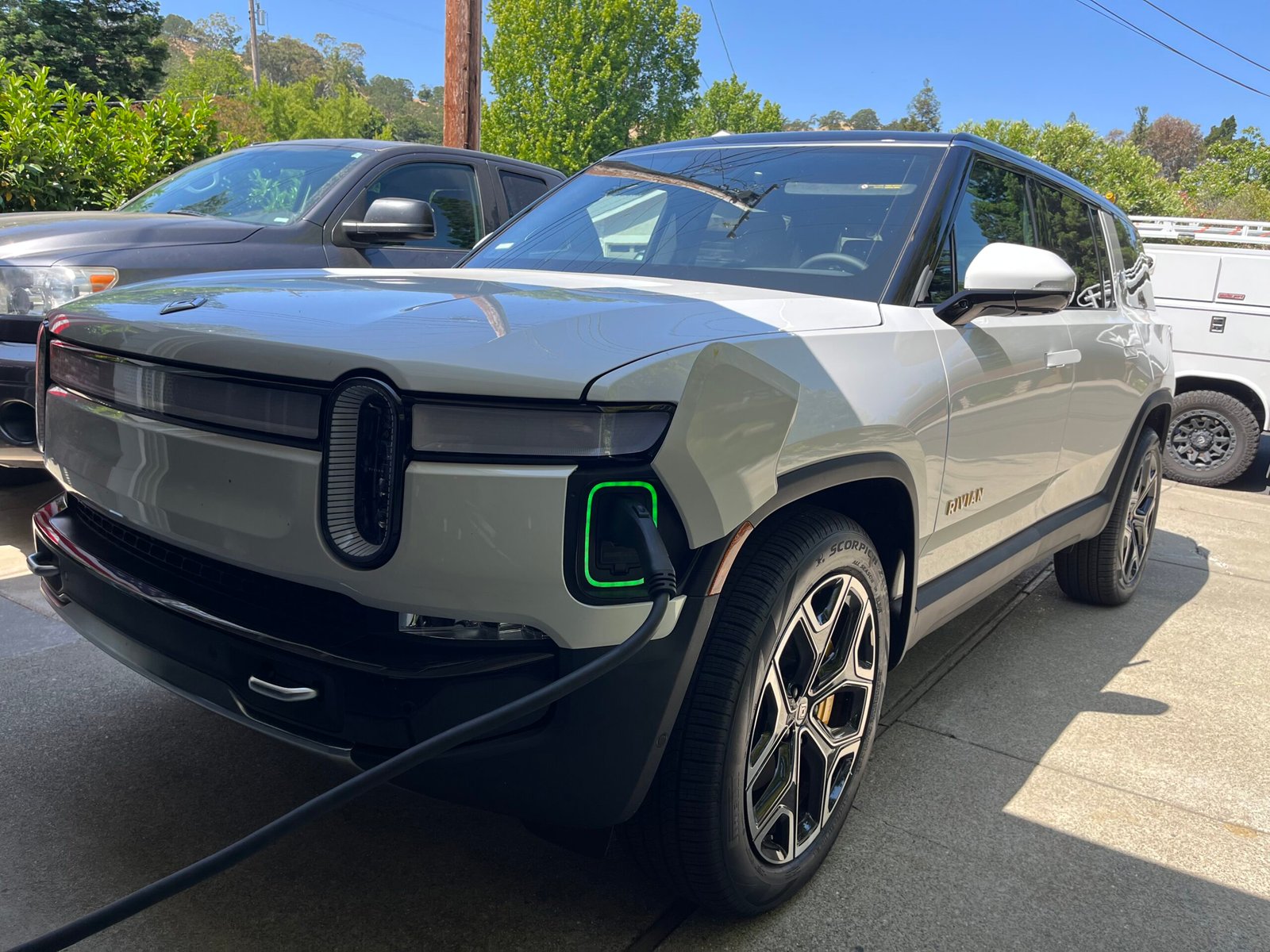 Rivian electric truck charging at a home charging station